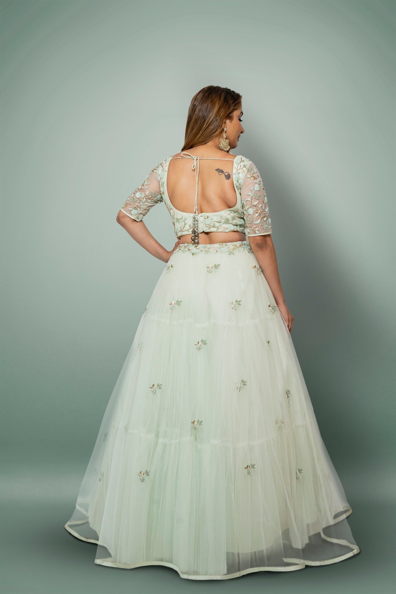 Sea Green Lehenga And A Crop Top Set In Floral Motifs Embroidery, Crafted In Net